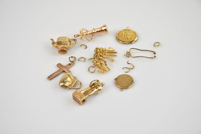 Lot 455 - Nine 9ct gold charms or pendants, including a...