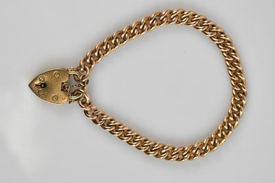Lot 566 - A 9ct rose gold bracelet with 9ct gold heart...