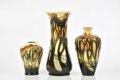 Lot 128 - EMMA BOSSONS FOR MOORCROFT; three vases...