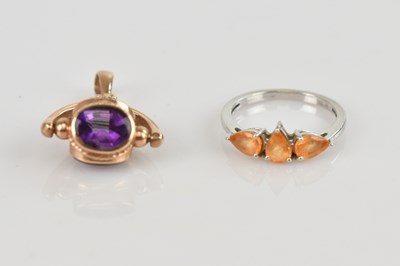 Lot 507 - A 9ct white gold dress ring with orange pear...