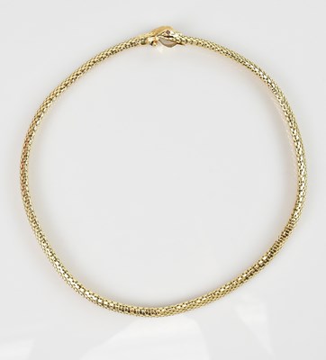 Lot 523 - A 14K yellow gold fancy necklace in the form...