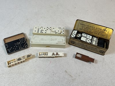 Lot 152 - Two miniature sets of dominoes in bone cases...
