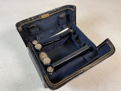 Lot 479 - A leather travelling case containing several...