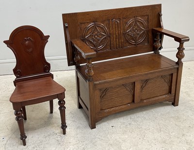 Lot 114 - An early 20th century carved oak monk's bench,...