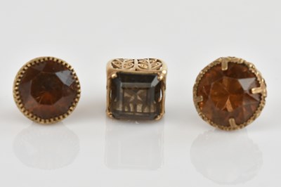 Lot 457 - Three 9ct gold watch fob seals, two with amber...