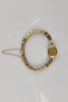 Lot 647 - ACCURIST; a lady's 9ct gold wristwatch, the...
