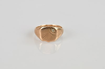 Lot 510 - A 9ct gold signet ring, with tiny star inset...