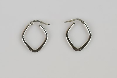 Lot 553 - A pair of 9ct white gold hoop earrings,...