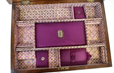 Lot 6 - A Victorian walnut sewing table, the top with...