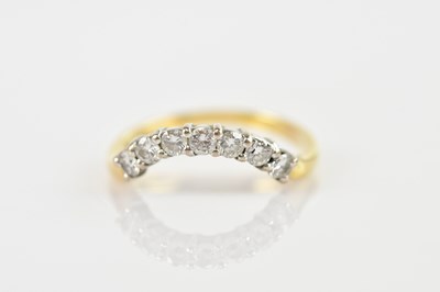 Lot 494 - An 18ct gold ring, with seven small diamonds...
