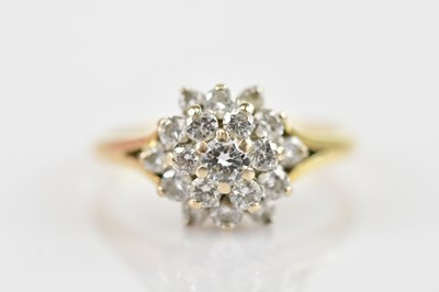 Lot 477 - An 18ct gold ring, with a diamond ball cluster...