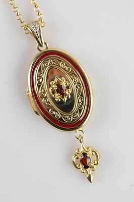 Lot 2145 - A yellow metal locket of oval form, set with a...