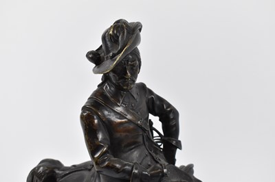 Lot 385 - A bronze figure of a cavalier on horseback,...