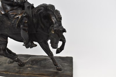 Lot 385 - A bronze figure of a cavalier on horseback,...