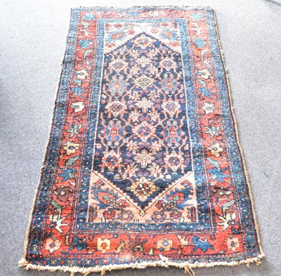 Lot 63 - A blue Persian rug, 150 x 83cm.