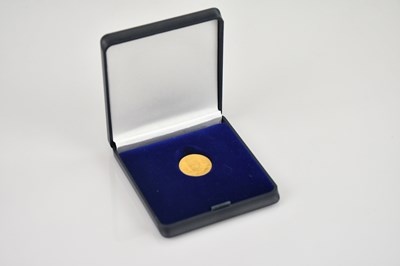 Lot 611 - A Persian half toman gold coin.