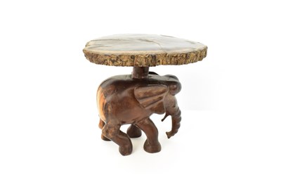 Lot 7 - A carved one-piece coffee table in the form of...