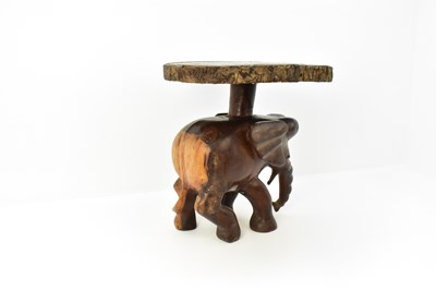 Lot 7 - A carved one-piece coffee table in the form of...