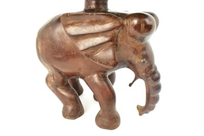 Lot 7 - A carved one-piece coffee table in the form of...