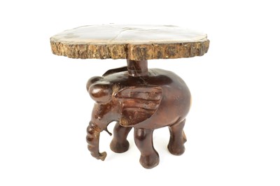 Lot 7 - A carved one-piece coffee table in the form of...