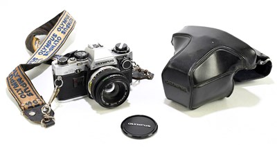 Lot 2603 - OLYMPUS; a OM10 camera, with a 50mm lens.