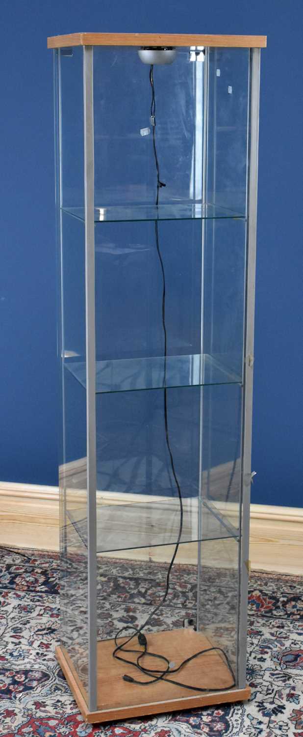 Lot 2986 - A modern IKEA display cabinet with three glass...