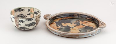 Lot 142 - A tin glazed earthenware twin handled platter,...