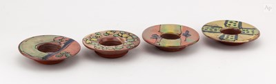 Lot 141 - A set of four slip decorated earthenware...