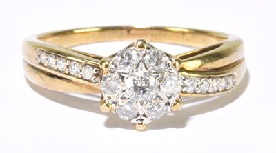 Lot 309 - A 9ct yellow gold diamond cluster ring with...