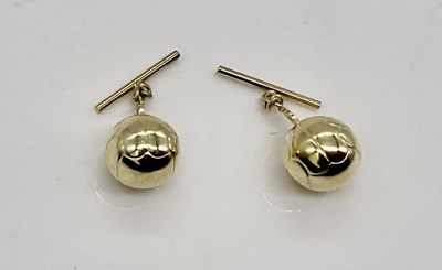 Lot 848 - A pair of 14ct gold 'football' cufflinks,...