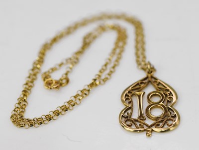 Lot 858 - A 9ct gold chain with '18' pendant, length...