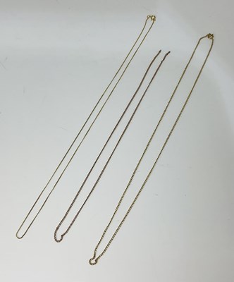 Lot 875 - Three 9ct gold fine link chains, combined...