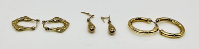 Lot 884 - Three pairs of 9ct gold earrings, combined...
