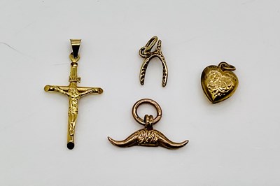 Lot 885 - Four 9ct gold pendants (one unmarked),...