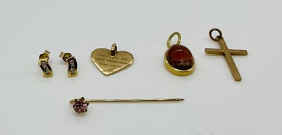 Lot 887 - Two 9ct gold pendants (combined approx 2.37g),...