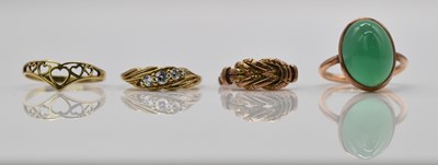 Lot 910 - A 9ct rose gold ring (split), a 9ct gold four...