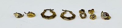Lot 911 - Three pairs of 9ct gold and yellow metal...