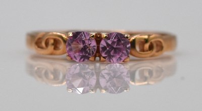 Lot 917 - A yellow metal two stone ring, stamped '583',...