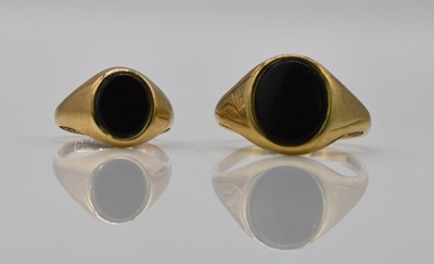 Lot 919 - Two 9ct gold signet rings, both set with black...