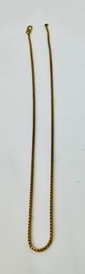 Lot 922 - A yellow metal chain stamped '22C', length...