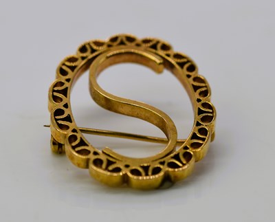 Lot 925 - A 9ct gold brooch inscribed 'S', 35 x 30mm,...