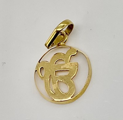 Lot 926 - An open circular pendant stamped '22C',...