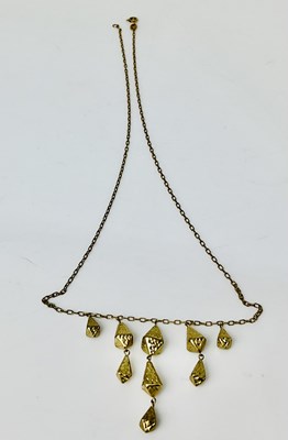 Lot 932 - A 9ct gold necklace with stepped drops, length...