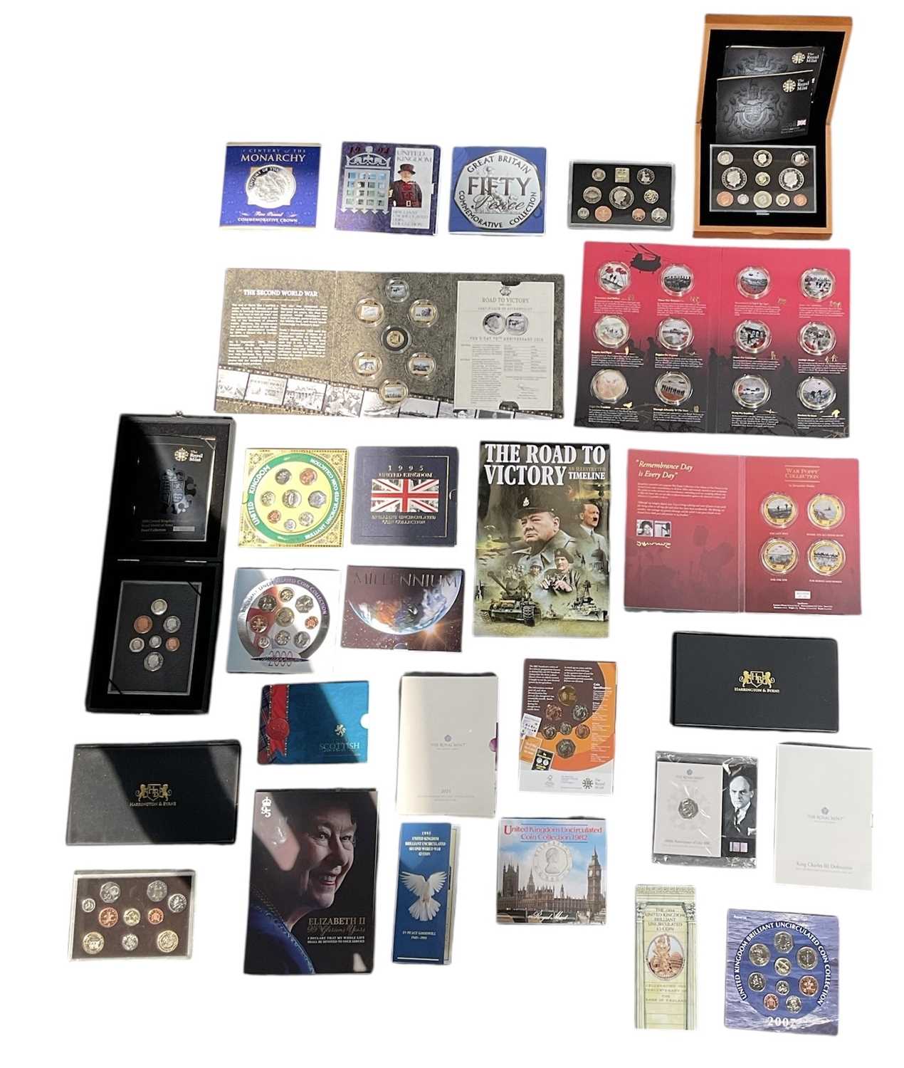Lot 615 - A collection of commemorative coin sets, year...