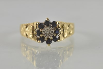Lot 498 - A 9ct yellow gold sapphire and diamond flower...