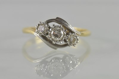 Lot 483 - An 18ct yellow gold and platinum diamond three...
