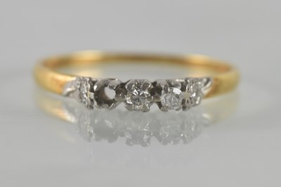 Lot 499 - An 18ct yellow gold diamond three stone ring...