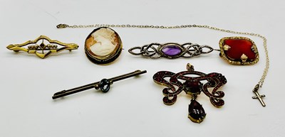 Lot 946 - A garnet set pendant, five brooches and a fine...