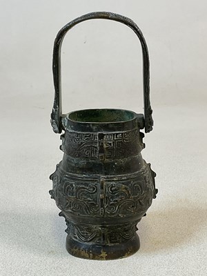 Lot 71 - A Chinese bronze vessel of archaic form, with...