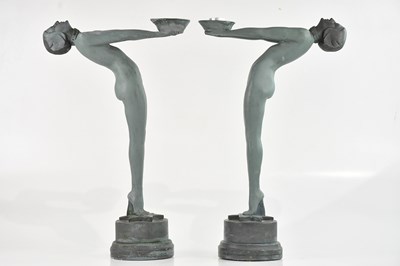 Lot 412 - A pair of plaster candle holders, both...